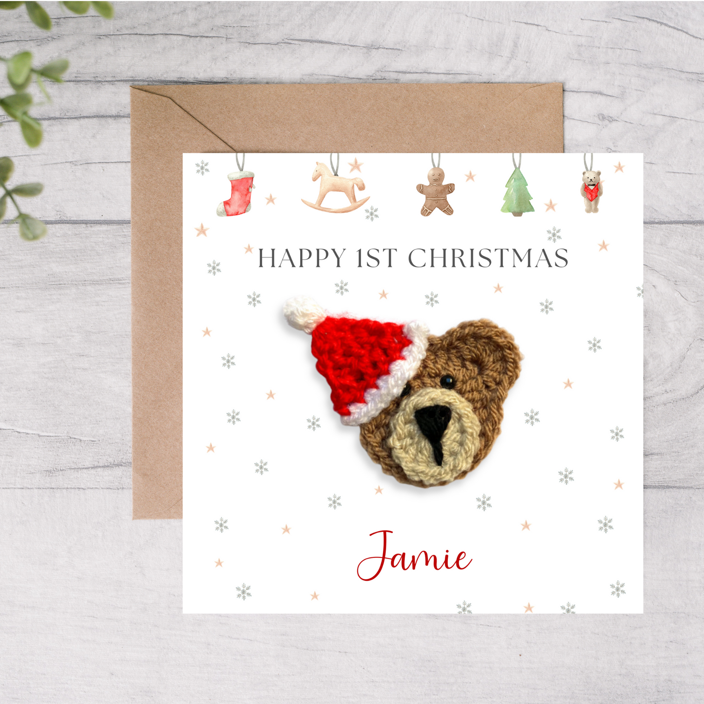 Christmas card with a bear wearing a Santa hat and 'Happy 1st Christmas Jamie' text on a white background.