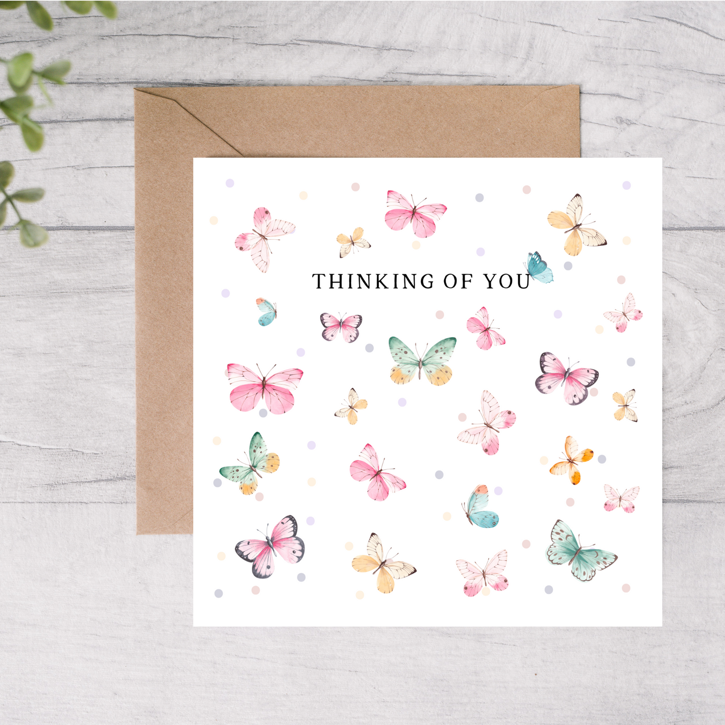 Greeting card with colorful butterflies and 'Thinking of You' text on a white background